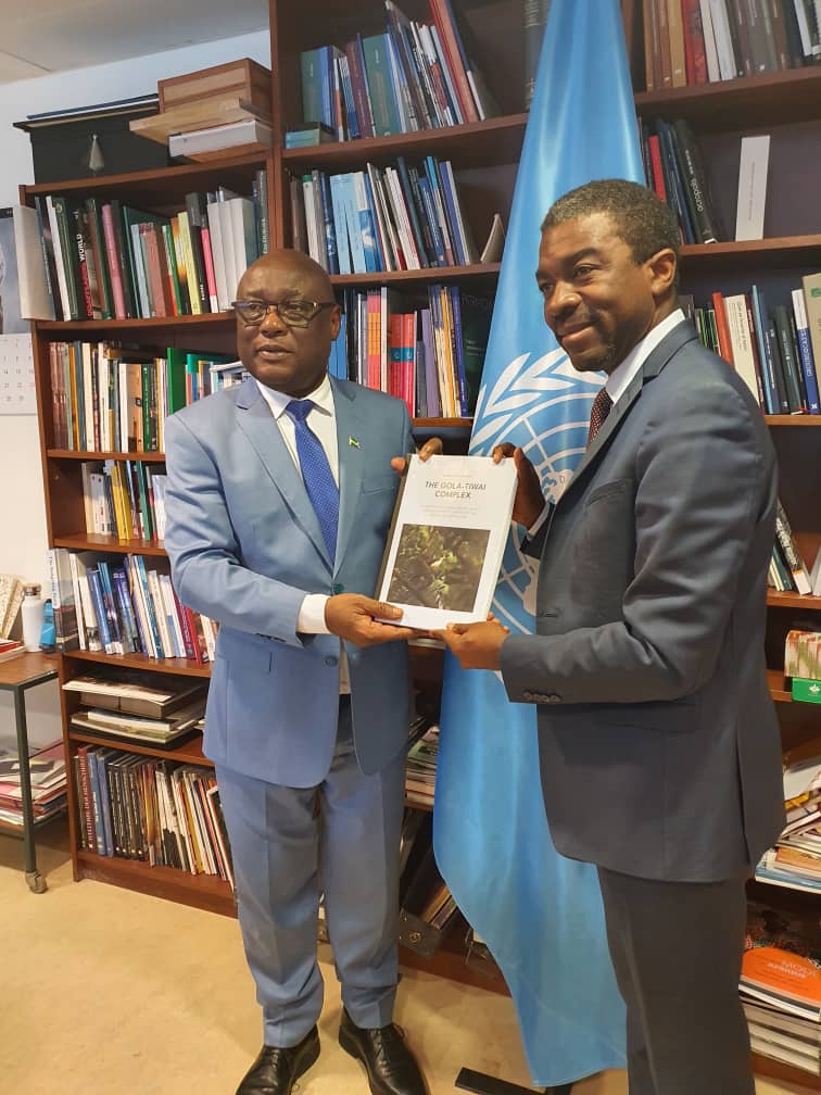 Sierra Leone's Ambassador to France, Mr Samuel Tamba Musa (left) hands over the dossier of Gola-Tiwai Complex to the Director General of the UNESCO World Heritage Centre in Paris.